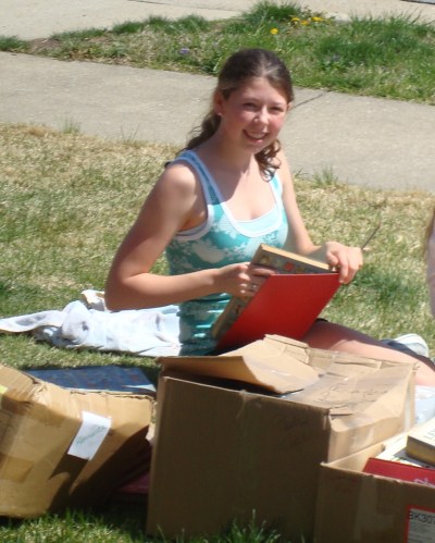 "Naked Book" Recycling Program, spring 2009. Elizabeth takes advantage of the fine weather!