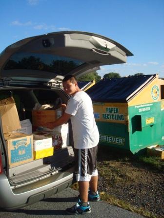 Success Won't Wait volunteer Matt McNeill unloads a van-load of paper to be donated to Brandywine Springs School.