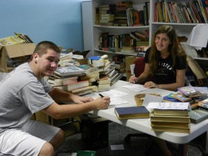 2011, epic book drive, matt and christine finish the last boxes Epic Book Drive organizer Christine McNeill receives some help with the final boxes from brother and fellow Success Won't Wait volunteer Matt McNeill.