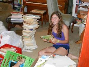 Compressed Christine Success Won't Wait Volunteer Christine McNeill helps remove book covers to ready the books for recycling.