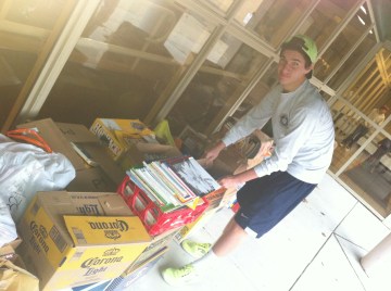 Long-time volunteer Vincenzo Carrieri-Russo helps loads thousands of pounds of donated books at the event.