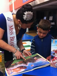 Margerita Carrieri-Russo has been a volunteer for Success Won’t Wait since 2002. Pictured here at the Forest Oak Elementary School Literacy Luau with faculty and one of the lucky students who received over 100 children’s books from Success Won’t Wait at the event.