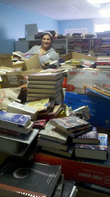 Sorting books is hard work and hardly glamourous, but dedicated volunteers like Margherita Carrieri-Russo keep Success Won't Wait projects going!