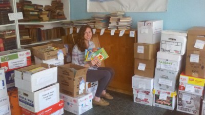 Success Won't Wait volunteer Christine McNeill with just a few of the books which were donated to Camden, NJ schools.