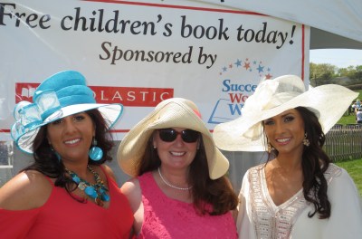 Margherita Carrieri-Russo and Success Won't Wait co-founders Susan Conforte McNeill and Vincenza Carrieri-Russo man the book giveaway tent at 2015 Point-to-Point.