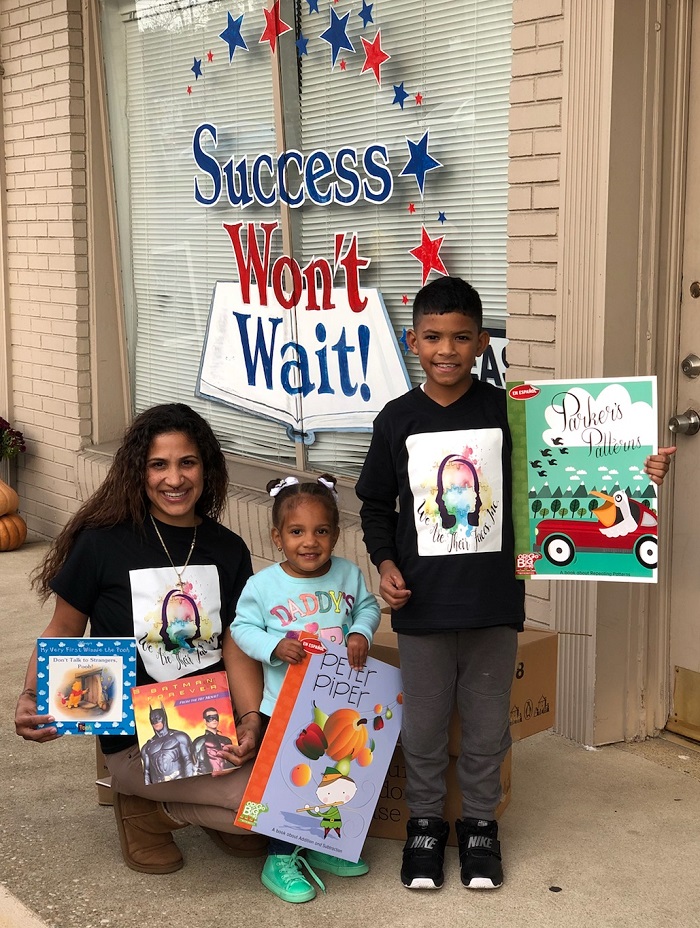 Many thanks to Johanna Vazquez and her family, pictured, who coordinated both book giveaways, and for all of those volunteers at We Are Their Faces, Inc. for encouraging all of us to Make a Change!